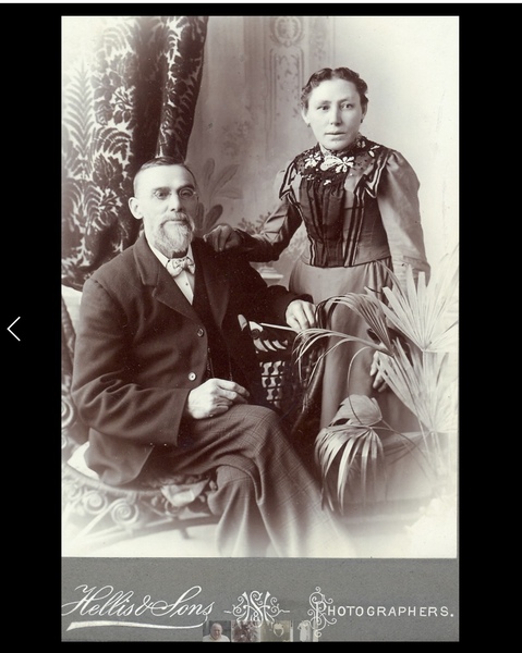 Can you date this very old photo by the clothes fashions?