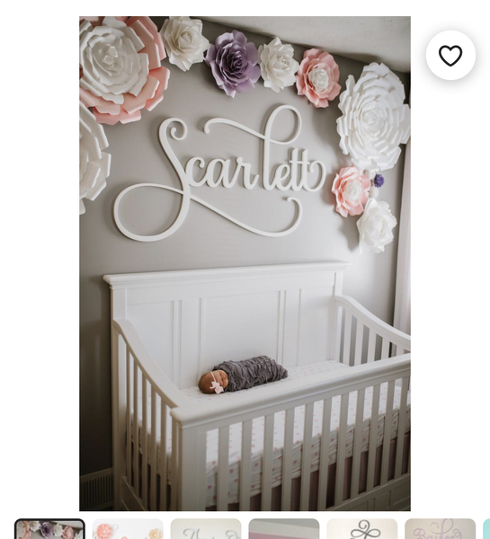 Are personalised name signs above the cot tacky?