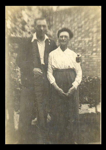 Can you date this very old photo by the clothes fashions?