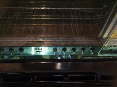 Any tips for cleaning the glass door of an oven?