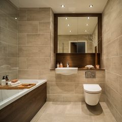 Fully tiled beige bathrooms..warm and neutral or out dated?