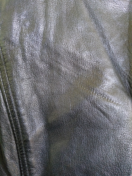 Zip imprint in new leather jacket - to remove or return?