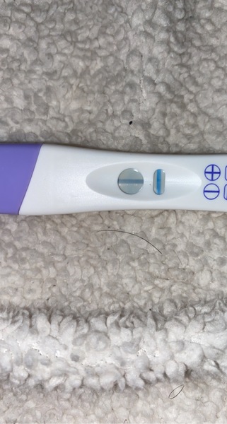 Digital says not pregnant but line there?