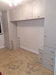 Small bedroom - wardrobes...over the bed or small gap at the end of the bed?