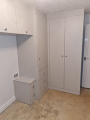Small bedroom - wardrobes...over the bed or small gap at the end of the bed?