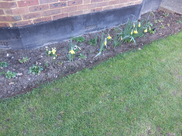 How do I level out a sloping lawn?