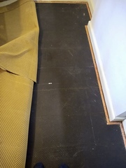 Black boards/laminate under carpet... what is it?
