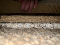 Black boards/laminate under carpet... what is it?