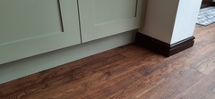 Skirting boards over kitchen plinths