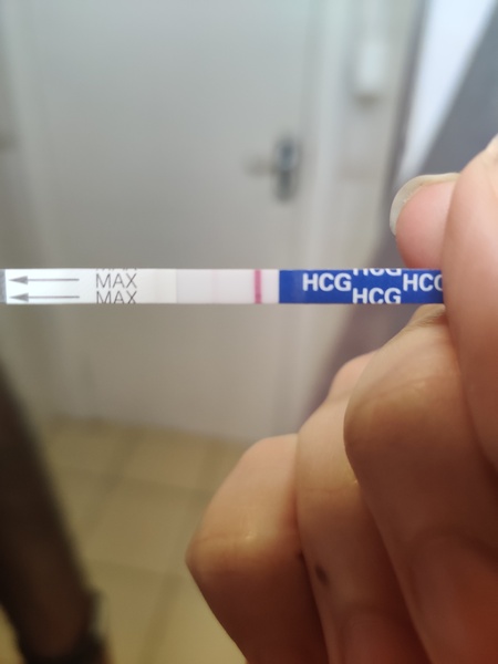 Faint line but brown discharge. Help!