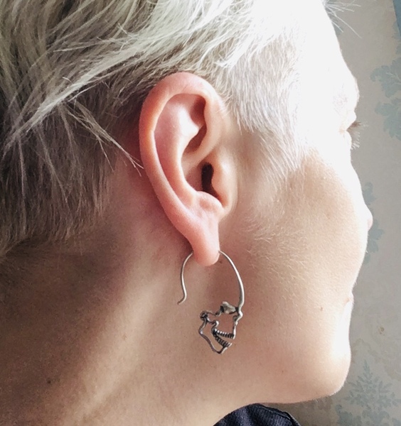 Do you have short hair and wear earrings?