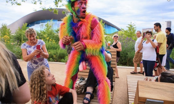 Obscene costumed volunteers handing out summer reading at Redbridge library