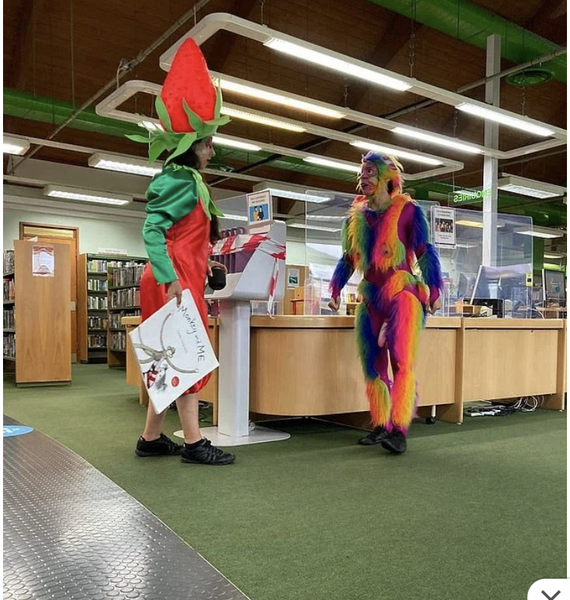 Obscene costumed volunteers handing out summer reading at Redbridge library