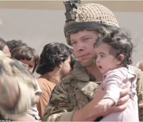 Little girl handed over to US soldiers