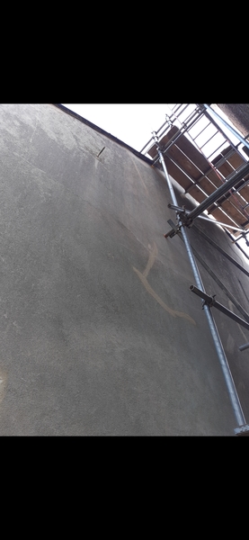 Damp patch on wall. Roof work hasn't helped