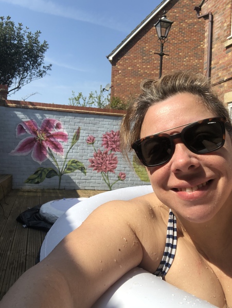 Neighbours have put panelling up on their did of the garden, it goes right up over our side of the fence & looks so ugly😢 what can we do our side to improve its appearance?