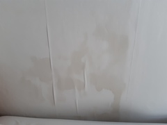 Damp patch on wall. Roof work hasn't helped