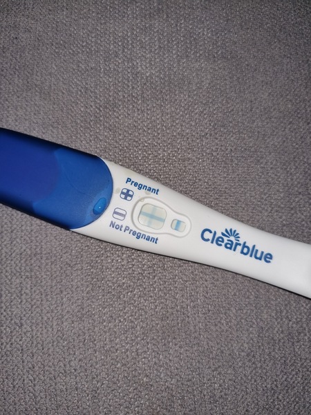 Ovulation test positive,  period due brown spotting