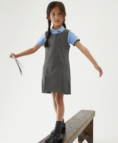 Why do girls wear pinfores and not school skirts ?