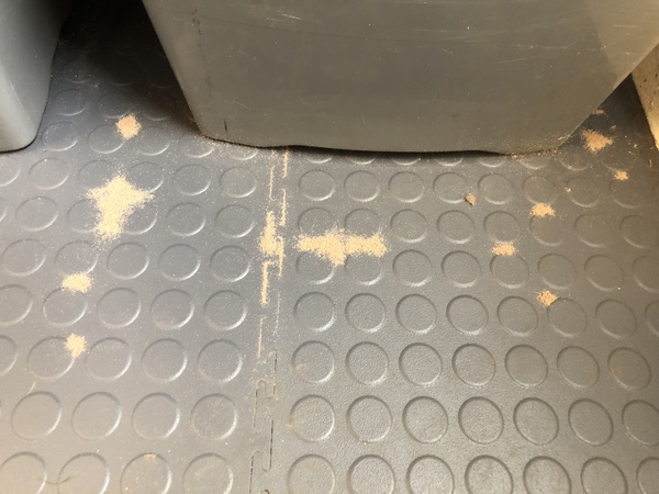 Mysterious sand-like piles appearing in garage