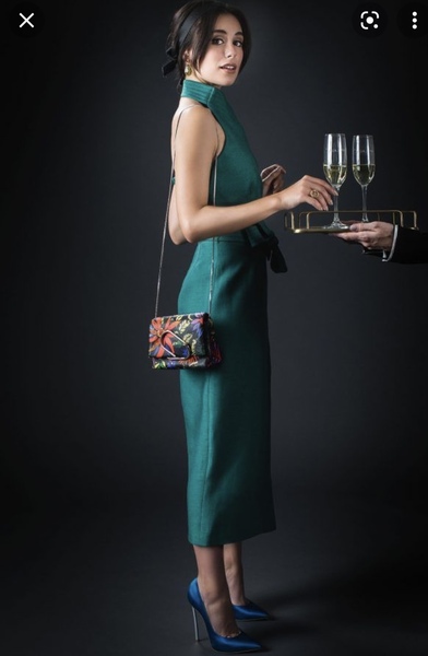 Jewel green evening frock. What colour bag?