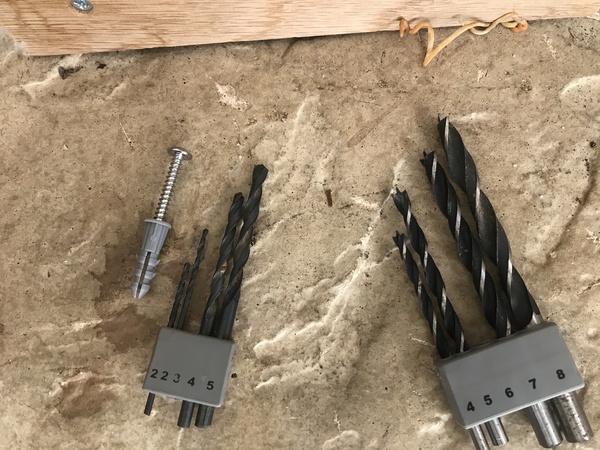 Trying to put up a toilet roll holder with wall plug, which drill part?