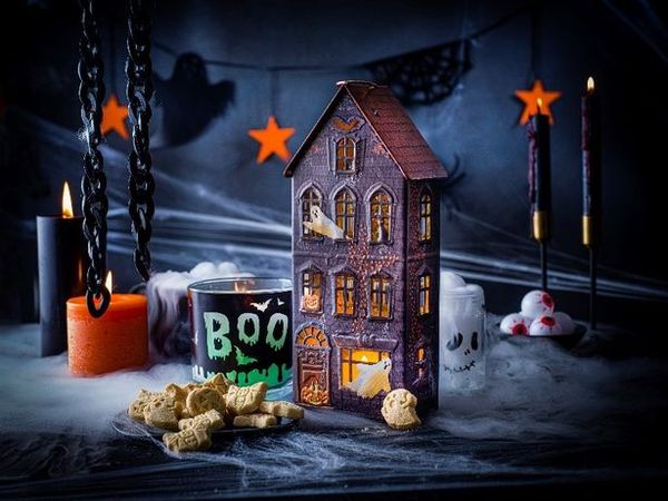 How do I open M&S Halloween haunted house biscuit tin?