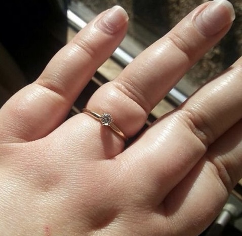 To show me your engagement rings?