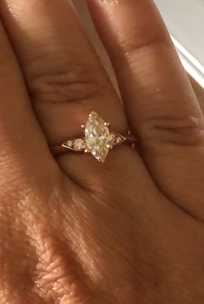 To show me your engagement rings?