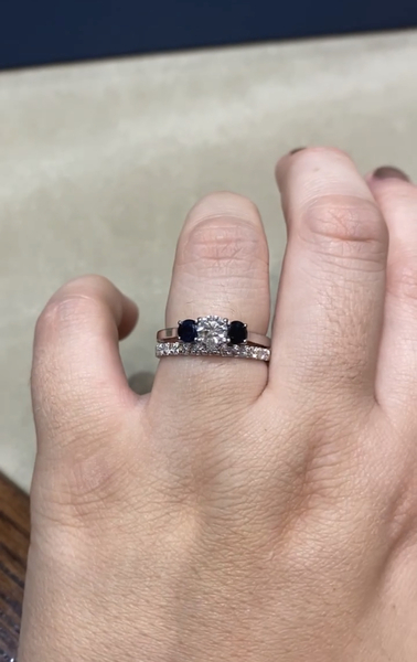To show me your engagement rings?