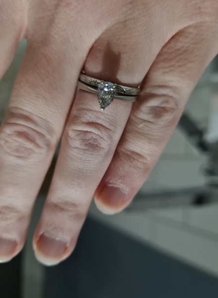 To show me your engagement rings?