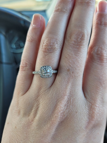 To show me your engagement rings?