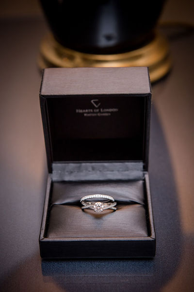 To show me your engagement rings?