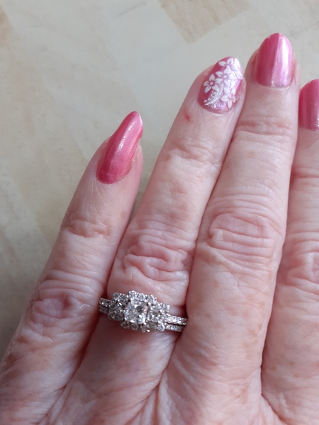 To show me your engagement rings?