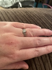To show me your engagement rings?