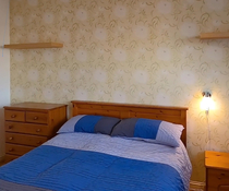 Making dated rustic style bed work?