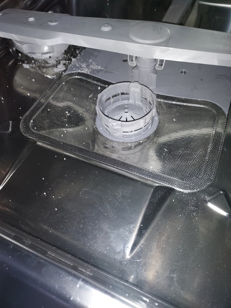 Why am I getting black bits in mugs/glasses from dishwasher?