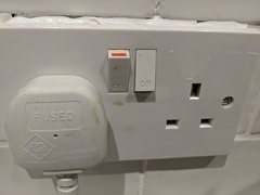 What can I use to fill gap above socket in tiles? About 0.5 cm thick