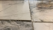 Floor tiles grout crack and uneven