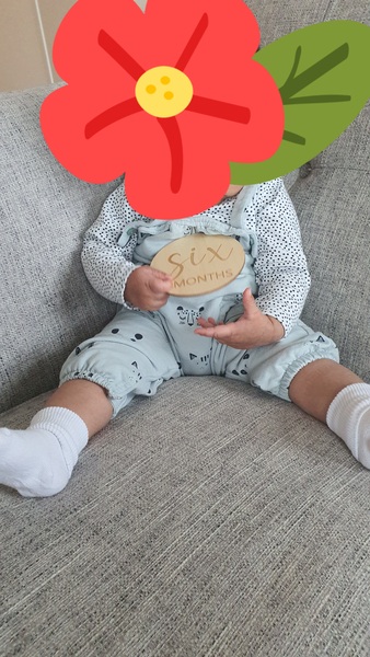 ***PIC ATTACHED***6 month old sitting with legs straight out not froggy style