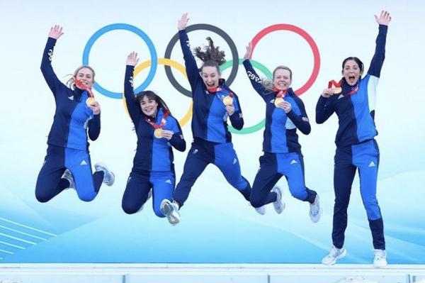 Curling team jumping for joy photo