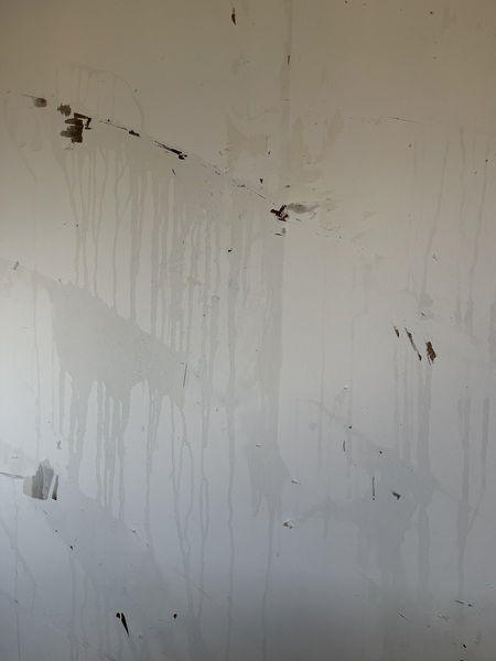 Taking wallpaper off - back paper sticking to wall