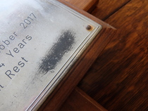 Polishing or making silver the metal on a grave marker