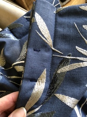 Do I remove the visible stitches from the pinch pleats of my curtains?