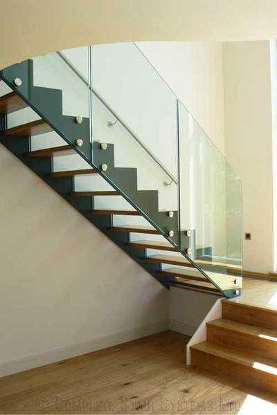 Storage ideas under steel/glass stairs
