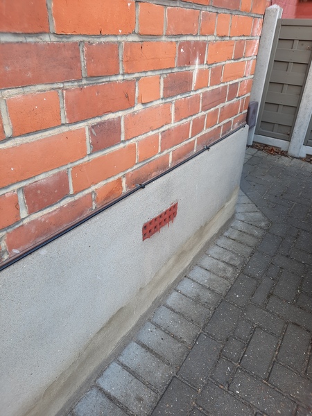 Which colour plinth outside house?