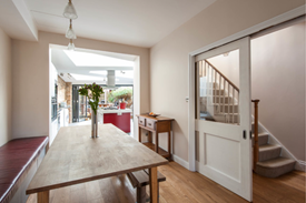 Considering no door on our kitchen. Thoughts on this or a pocket door?