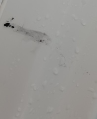 Black particles coming out of hot tap