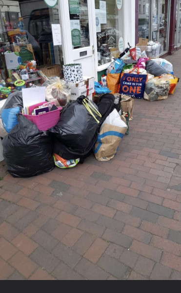 Fly tipping outside charity shop