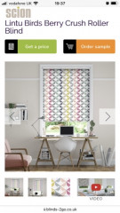Colourful blind in neutral kitchen